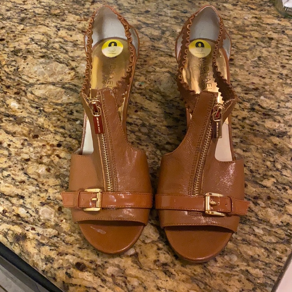 Micheal kors sandals with a wedge heels 8/12 tan color